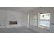 Spacious living room with a fireplace and large windows at 2055 Ripple Park Bnd, Canton, GA 30114