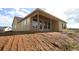 New construction home featuring a covered porch and large windows that bring in natural light at 2055 Ripple Park Bend, Canton, GA 30114