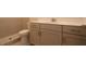 Modern bathroom featuring a vanity with sleek cabinetry, a countertop, and tiled shower at 2055 Ripple Park Bnd, Canton, GA 30114