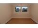 Bedroom with view of street and neighboring house through windows at 2055 Ripple Park Bnd, Canton, GA 30114
