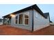 Exterior view of the single-Gathering home highlighting the back of the house with large windows at 2055 Ripple Park Bnd, Canton, GA 30114