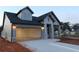 Well-lit single Gathering home with a two-car garage, showing the attractive exterior and neighborhood at 2055 Ripple Park Bnd, Canton, GA 30114
