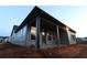Exterior of the single-Gathering home featuring a cozy covered patio perfect for outdoor relaxation at 2055 Ripple Park Bnd, Canton, GA 30114