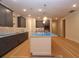 Modern kitchen featuring a large island, custom cabinets, and sleek countertops at 2055 Ripple Park Bnd, Canton, GA 30114