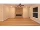 Spacious living room featuring a stone fireplace, recessed lighting, and large windows at 2055 Ripple Park Bnd, Canton, GA 30114