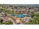 Aerial shot of community tennis courts, pool, and playground, surrounded by mature trees at 3149 Hidden Falls Ne Dr, Buford, GA 30519