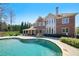 Stunning backyard pool and patio area, perfect for outdoor entertaining and relaxation at 3149 Hidden Falls Ne Dr, Buford, GA 30519