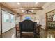 Finished basement featuring a seating area and bar with unique stone accents and lighting at 3149 Hidden Falls Ne Dr, Buford, GA 30519