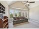 Bedroom with vaulted ceilings, fan and several windows providing natural light and backyard views at 3149 Hidden Falls Ne Dr, Buford, GA 30519
