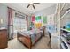 Bright bedroom with large window, vaulted ceiling, and warm, neutral colors at 3149 Hidden Falls Ne Dr, Buford, GA 30519