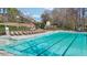 Community pool with ample seating around deck, perfect for relaxing by the water at 3149 Hidden Falls Ne Dr, Buford, GA 30519