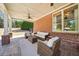 Charming covered patio with comfortable seating, perfect for enjoying the outdoors in style at 3149 Hidden Falls Ne Dr, Buford, GA 30519