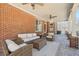 Covered patio area features a lounge area with an outdoor rug, perfect for relaxation and entertaining at 3149 Hidden Falls Ne Dr, Buford, GA 30519
