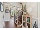 Inviting foyer showcasing hardwood floors, a staircase with iron railings, and views into the living area at 3149 Hidden Falls Ne Dr, Buford, GA 30519