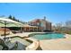 Stunning pool and spa area featuring a brick home and outdoor seating, perfect for relaxing and entertaining at 3149 Hidden Falls Ne Dr, Buford, GA 30519