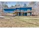 Back exterior featuring a deck, patio doors, and access to a yard at 2970 Oxford Rd, Atlanta, GA 30349