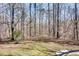 Expansive backyard with trees, grassy area, and satellite dish at 2970 Oxford Rd, Atlanta, GA 30349
