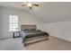 Spacious bedroom featuring carpet, ceiling fan, and a window with natural light at 2970 Oxford Rd, Atlanta, GA 30349