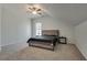 Spacious bedroom featuring carpet, ceiling fan, and a window with natural light at 2970 Oxford Rd, Atlanta, GA 30349
