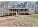 Charming blue home with a welcoming front porch and classic architectural details at 2970 Oxford Rd, Atlanta, GA 30349