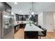 Contemporary kitchen boasts stainless steel appliances and a stylish island with bar seating at 2970 Oxford Rd, Atlanta, GA 30349