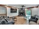 Inviting living room featuring a stone fireplace, plush seating, and natural light at 2970 Oxford Rd, Atlanta, GA 30349