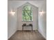 Bright sitting area with a arched window and decorative sconces, perfect for relaxing at 2970 Oxford Rd, Atlanta, GA 30349