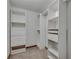Walk-in closet featuring multiple storage options including shelves, drawers, and hanging rods at 2970 Oxford Rd, Atlanta, GA 30349