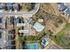 Aerial view highlighting community amenities including a pool, clubhouse, playground, and tennis courts at 2121 Hempstead Ct, Snellville, GA 30078
