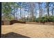 Expansive back yard, enclosed by a wooden fence, offering ample space for outdoor activities and privacy at 2121 Hempstead Ct, Snellville, GA 30078