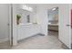 Well-lit bathroom with a large mirror, vanity, and open access to the main bedroom for added convenience at 2121 Hempstead Ct, Snellville, GA 30078