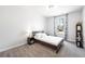 Simple bedroom with neutral walls, carpet, a single bed, and a window with natural light at 2121 Hempstead Ct, Snellville, GA 30078