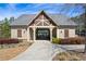 Attractive clubhouse, beautifully landscaped, with manicured shrubs, offering a welcoming space for community gatherings and recreation at 2121 Hempstead Ct, Snellville, GA 30078