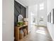 Stylish entryway with a decorative accent wall, wood floors, and a welcoming atmosphere at 2121 Hempstead Ct, Snellville, GA 30078