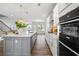 Spacious kitchen with a large island, modern appliances, and open layout to the living area at 2121 Hempstead Ct, Snellville, GA 30078