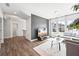 Inviting living room with bright windows, stylish decor, and wood-look flooring for a welcoming atmosphere at 2121 Hempstead Ct, Snellville, GA 30078