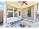 Cozy patio featuring comfortable seating, a modern fire pit, string lights, and backyard views at 2121 Hempstead Ct, Snellville, GA 30078