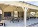 Outdoor patio area with ceiling fans, tables and chairs, perfect for gatherings at 2121 Hempstead Ct, Snellville, GA 30078