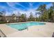 Community pool with clear water and ample sunlight surrounded by trees at 2121 Hempstead Ct, Snellville, GA 30078