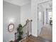 Staircase with dark metal railings, wood steps, and a view into a bedroom at 2121 Hempstead Ct, Snellville, GA 30078