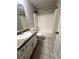 Bathroom with a shower/tub combination, tile flooring, and granite vanity at 3013 Rockview Dr, Loganville, GA 30052
