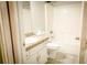 Bathroom featuring a granite vanity and shower-tub combo at 3013 Rockview Dr, Loganville, GA 30052