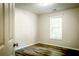 Cozy bedroom with hardwood floors, natural light, and a view of lush greenery at 3013 Rockview Dr, Loganville, GA 30052