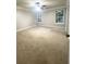 Bright bedroom with two windows that bring in plenty of natural light and wall-to-wall carpeting at 3013 Rockview Dr, Loganville, GA 30052