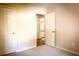 Bright bedroom featuring neutral walls, carpet flooring, and an ensuite bathroom, enhancing comfort and convenience at 3013 Rockview Dr, Loganville, GA 30052