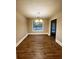 A bright dining room with wood floor and window at 3013 Rockview Dr, Loganville, GA 30052