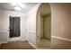 Bright entryway with wood and tile flooring, neutral paint, and an arched doorway at 3013 Rockview Dr, Loganville, GA 30052