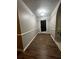 Entry hallway with new flooring, neutral paint and traditional wainscoting at 3013 Rockview Dr, Loganville, GA 30052