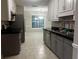Kitchen features stainless steel appliances, ample cabinet space, and tile flooring at 3013 Rockview Dr, Loganville, GA 30052