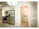 Bright kitchen with stainless appliances, white cabinetry, and a view to the laundry room at 3013 Rockview Dr, Loganville, GA 30052